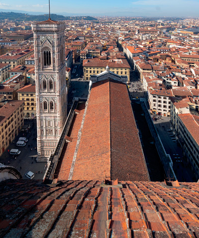 The Campanile and the body  of the Cathedral seen from the Dome,  projects which involved Arnolfo di Cambio,  Andrea Pisano, Giotto for the first part  of the Campanile, Francesco Talenti and others